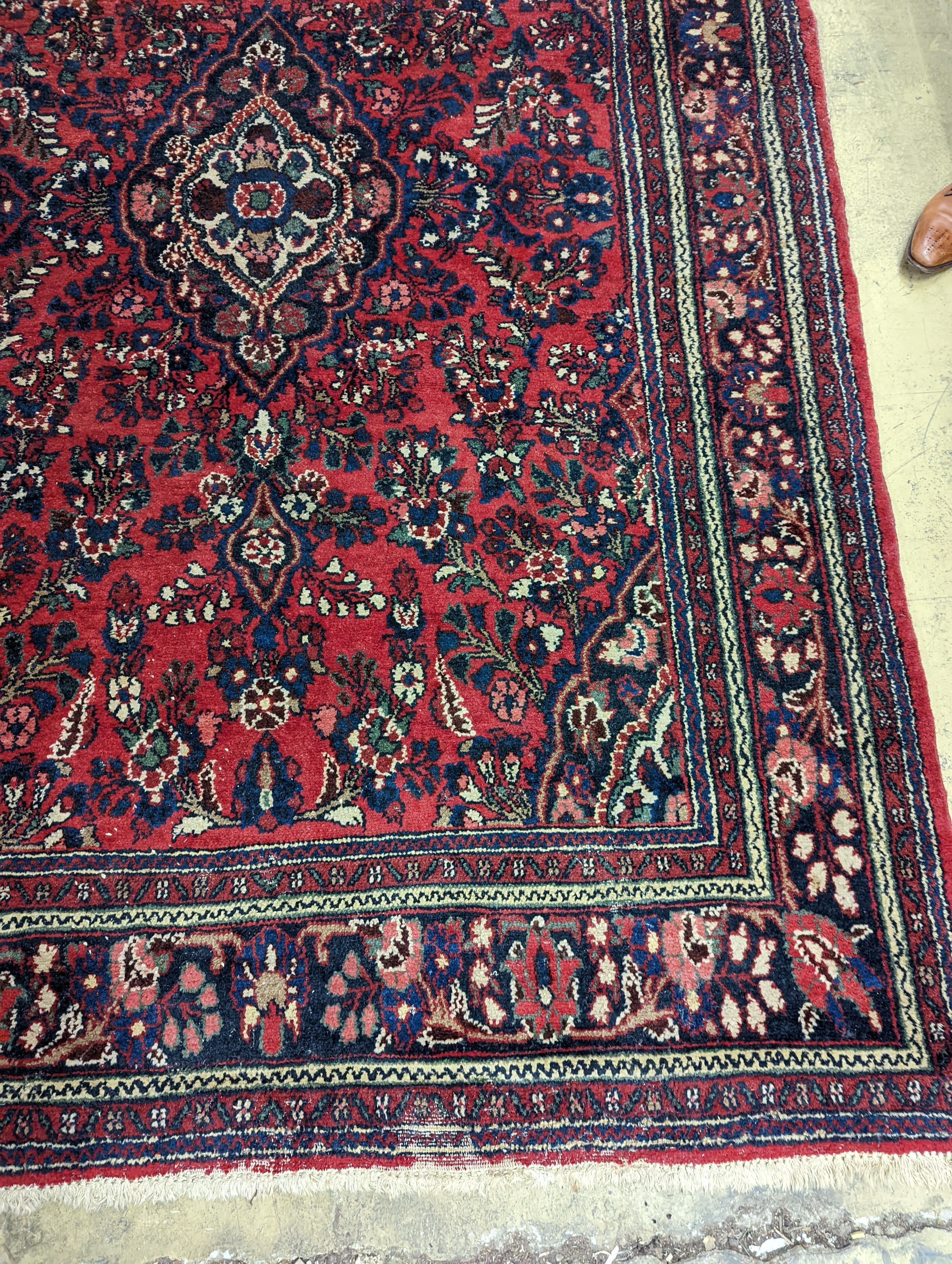 A Tabriz style red ground carpet, 290 x 190cm